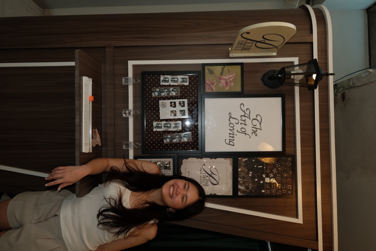 A guest by the Picture Perfect booth at Klu Cafe